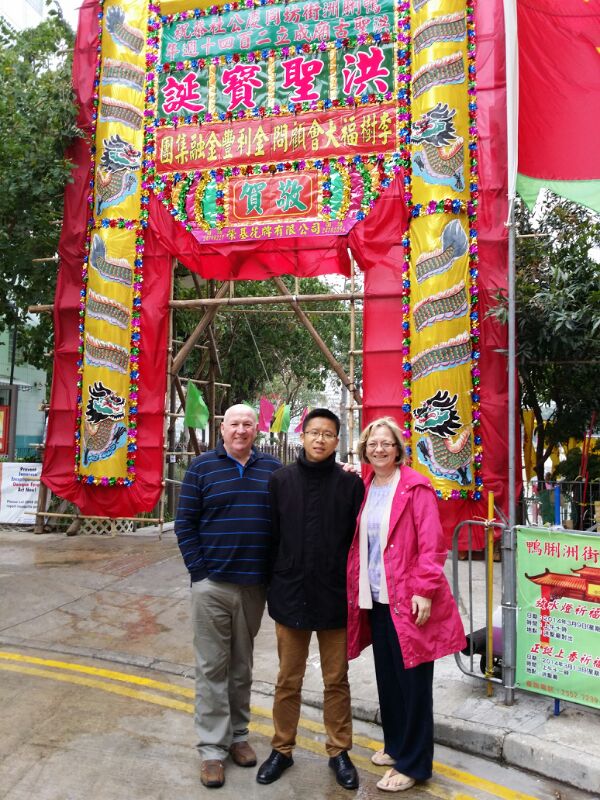 Frank the tour guide takes photo with Ian and his wife in front of the festive decoration