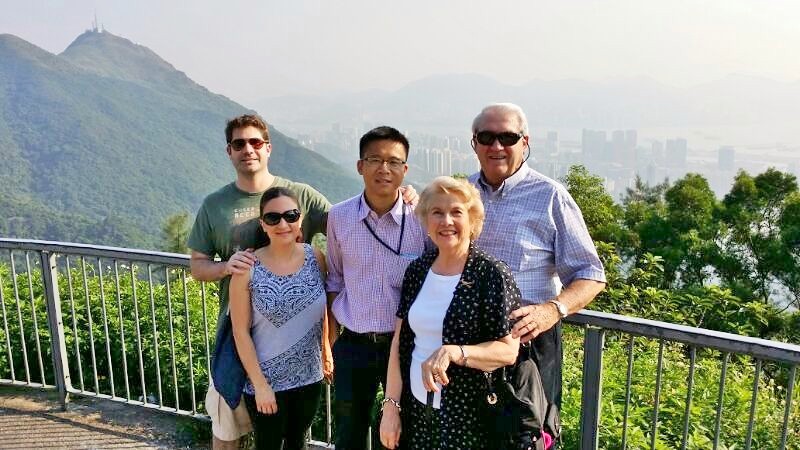 Frank the tour guide takes photo with James B small group at Kowloon Peak
