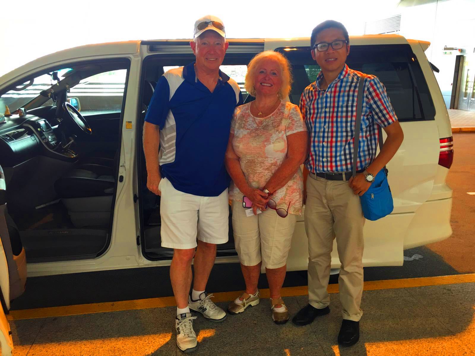 Frank the tour guide takes photo in front of the car with Mr and Mrs Ridenour from Ovation of the Seas.