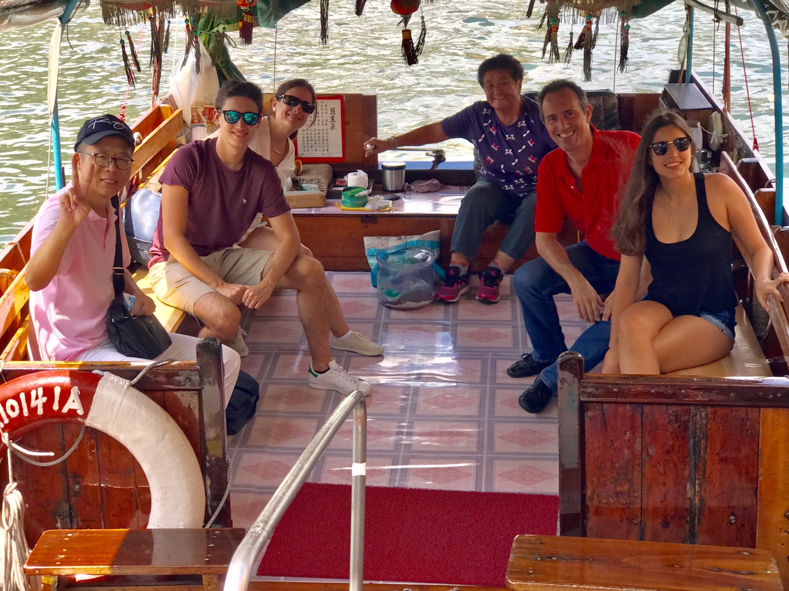 Frank takes the photo with Paulo and his families during the sampan ride at Aberdeen Fishing Village