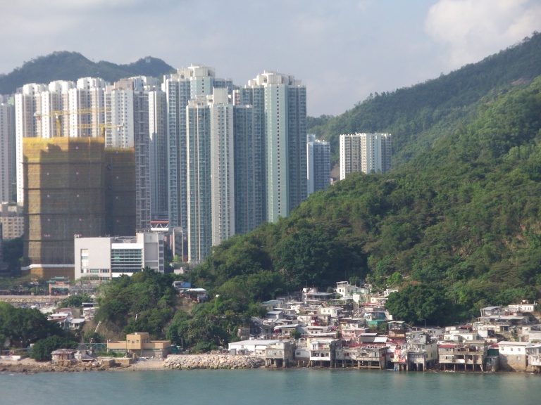 tall buildings, stilt houses, sea view