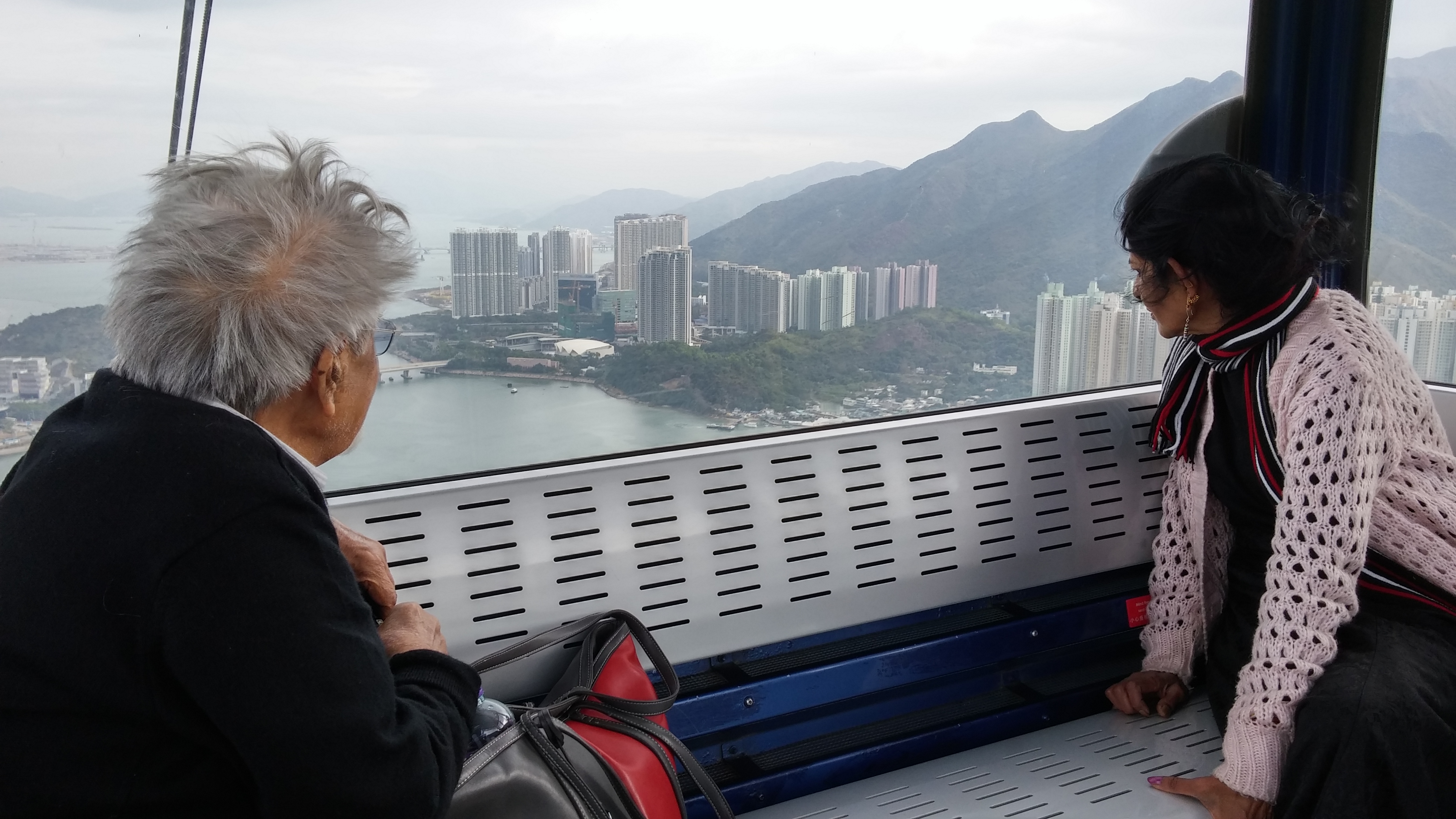 Mr and Mrs Rao taking Ngong Ping Cable Car