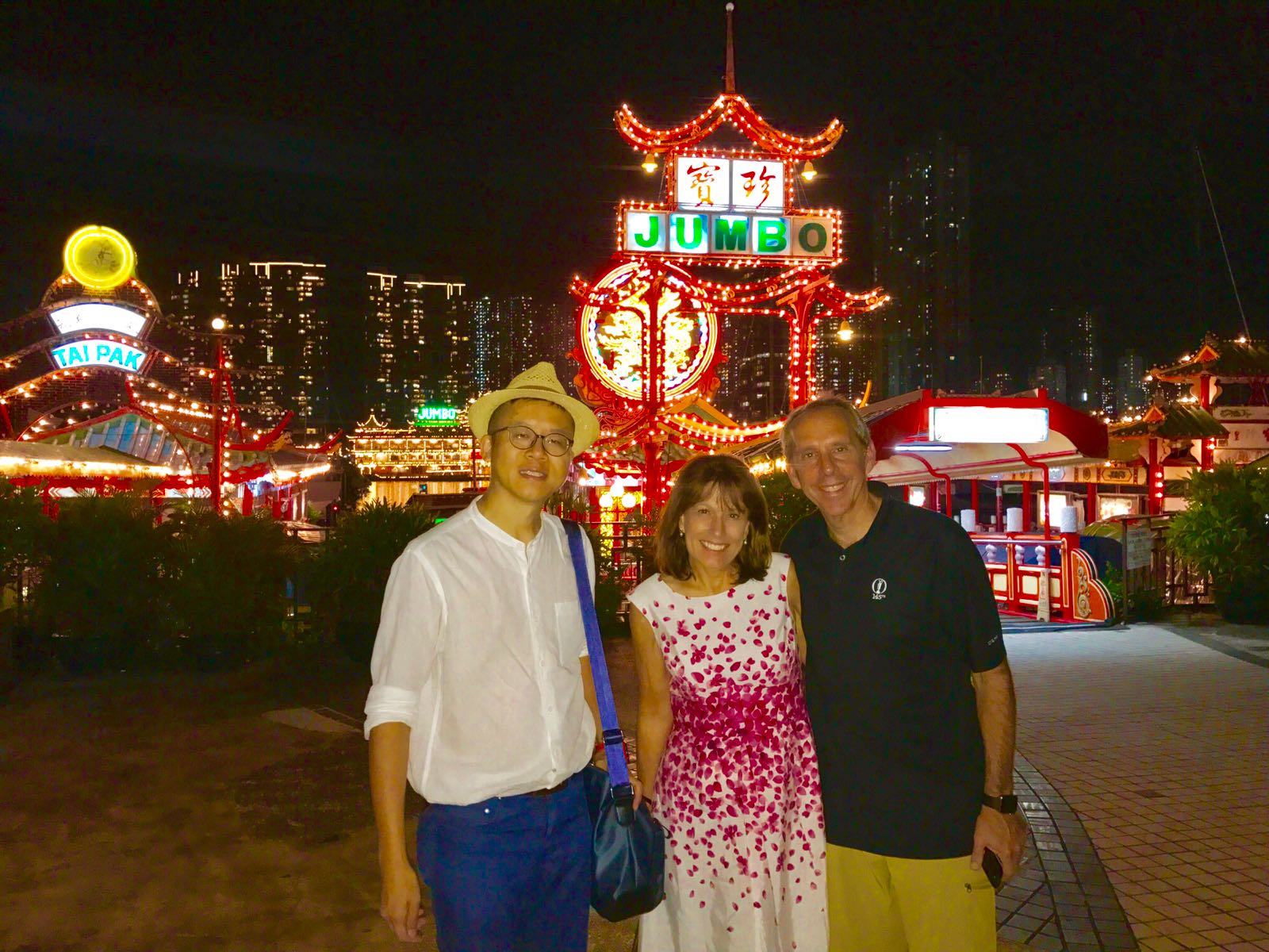 Frank the tour guide, Mrs Raffkind, Mr Raffkind, colorful Jumbo Restaurant Ferry pier, at night