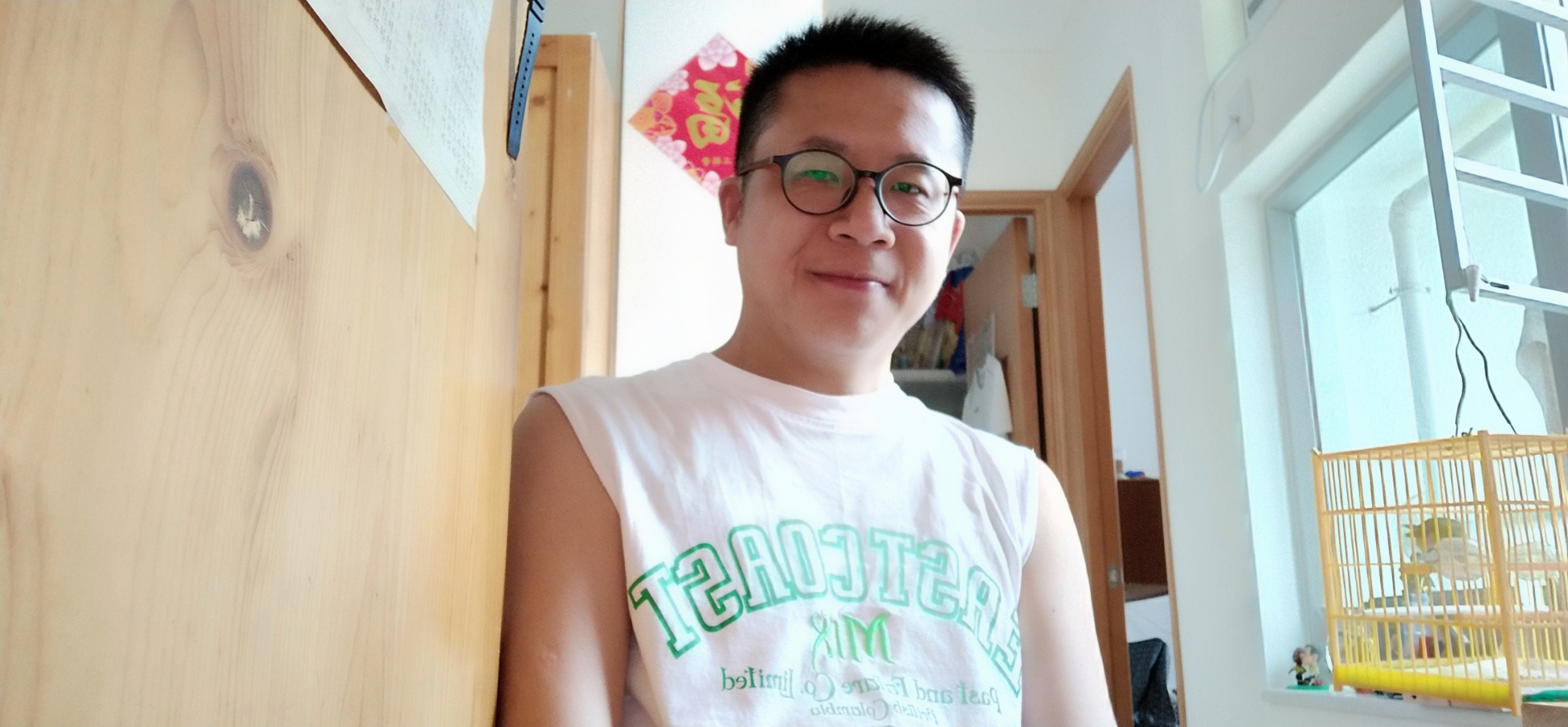 selfie, Frank the tour guide in white T-shirt, bedroom, bird cage