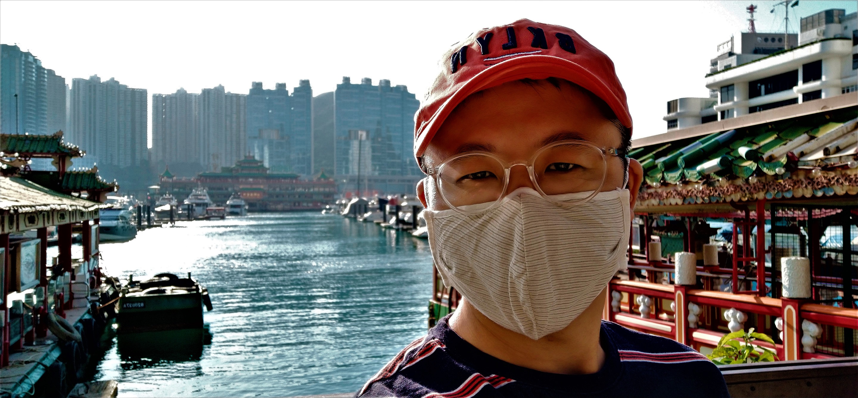 Frank the tour guide takes selfie with the closed Jumbo Floating Restaurant